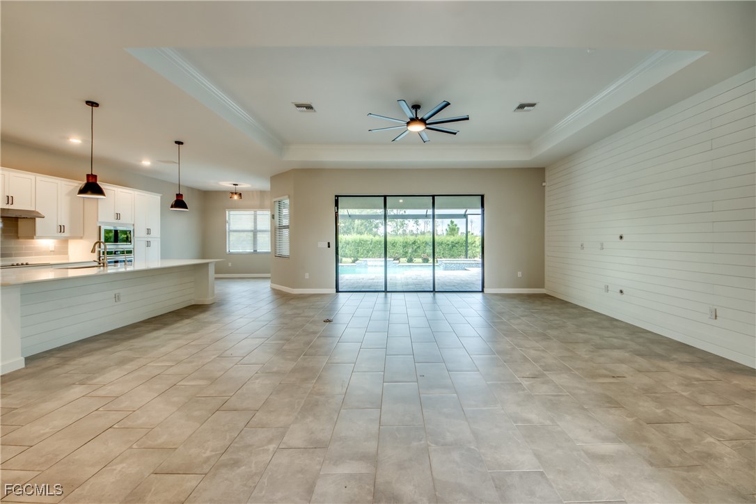 11674 Russet Trail Fort Myers, FL 33913 - Photo 7 of 47 a view of an empty room with a kitchen
