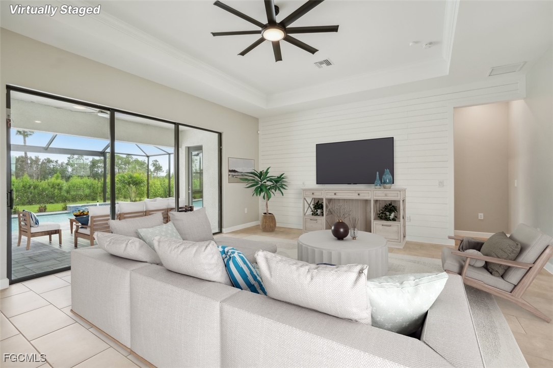 11674 Russet Trail Fort Myers, FL 33913 - Photo 8 of 47 a living room with furniture large window and a flat screen tv