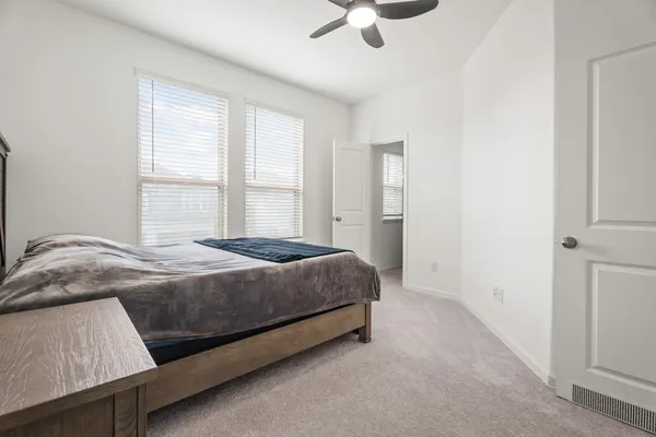 a bedroom with a bed and window