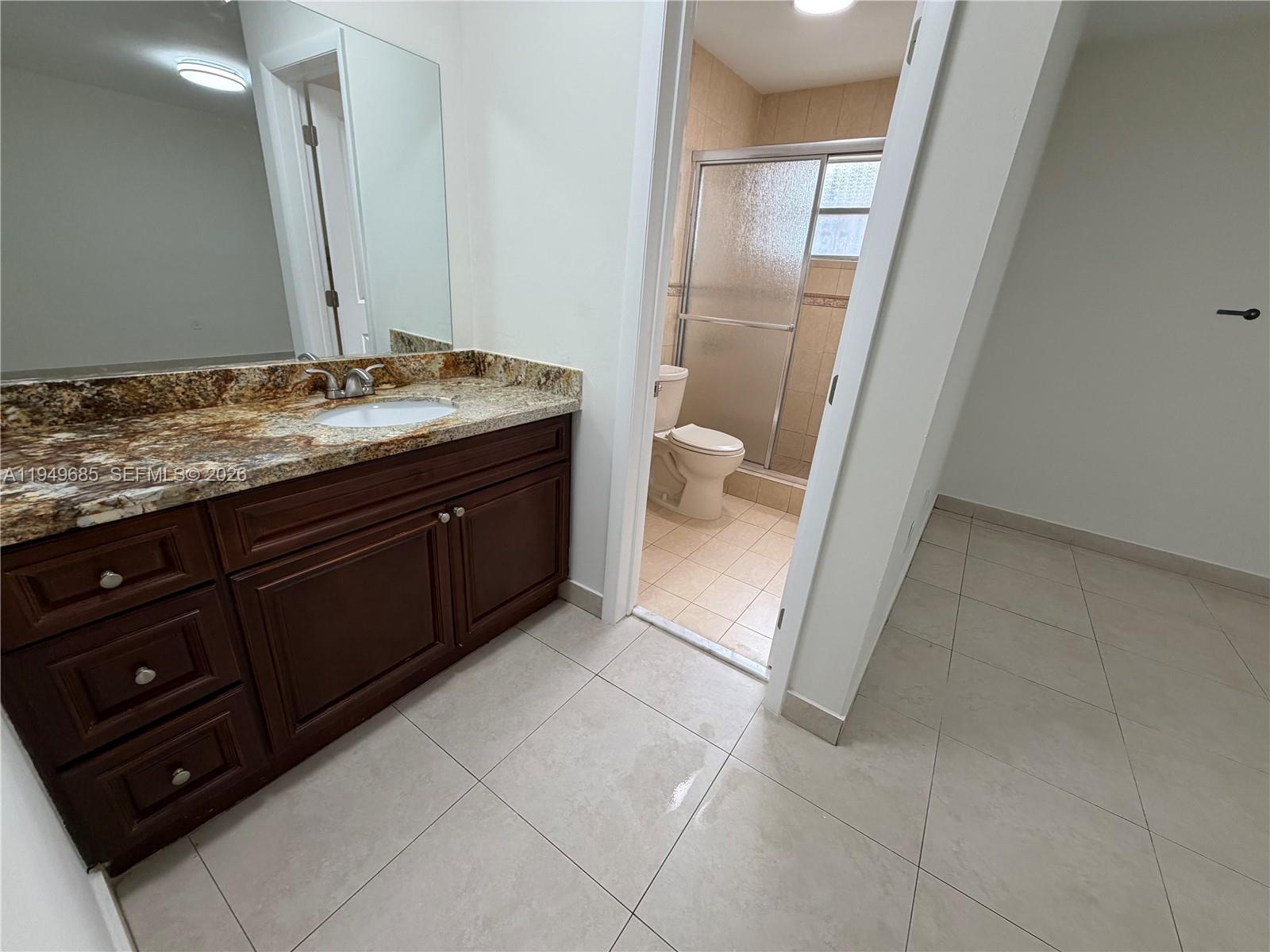 425 East 17th Street Hialeah, FL 33010 - Photo 11 of 24 vanity and bathroom primary bedroom