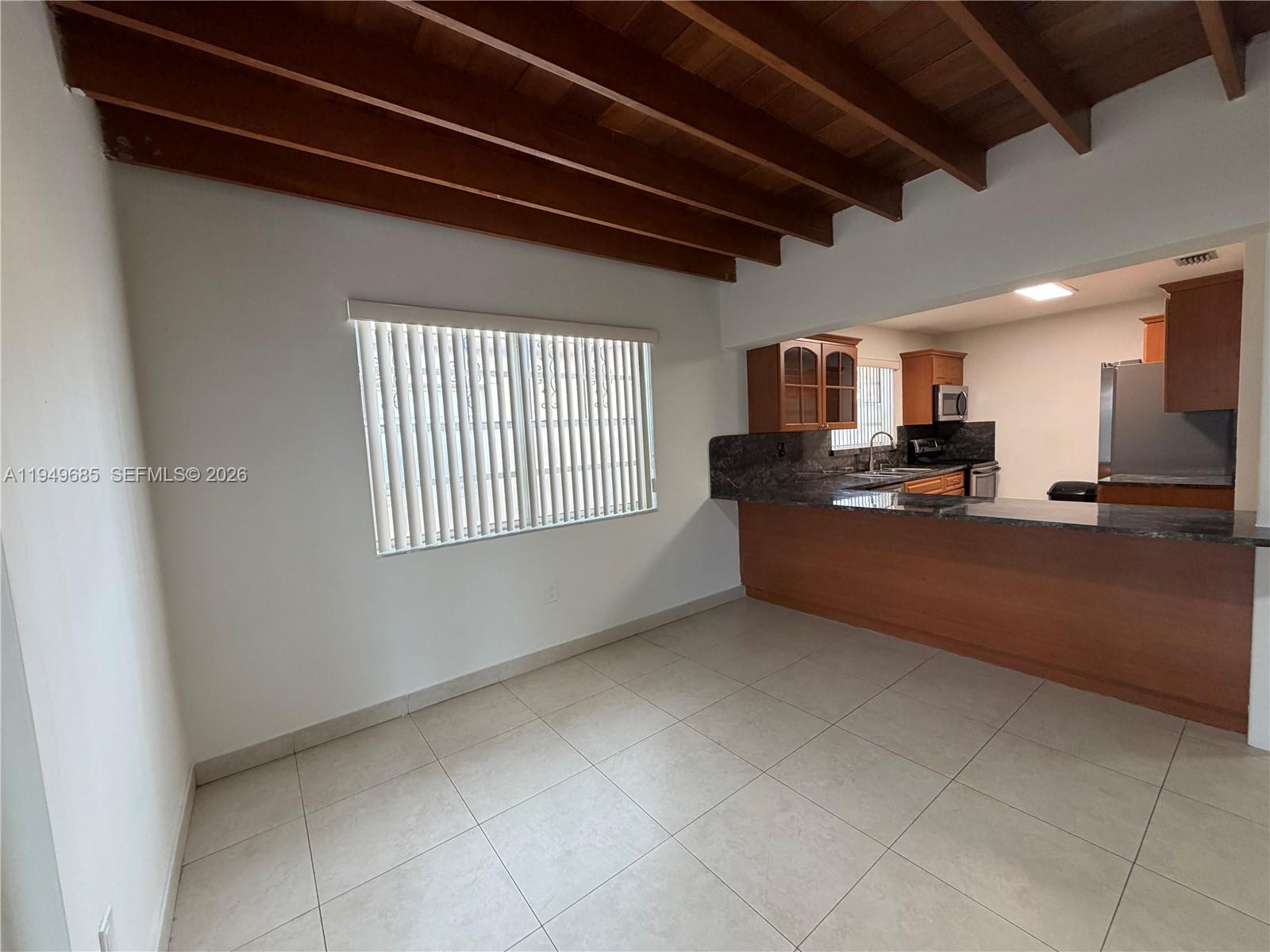 425 East 17th Street Hialeah, FL 33010 - Photo 8 of 24 Florida room and kitchen