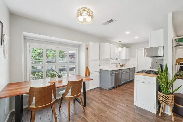 a view of kitchen with dining table and chairs