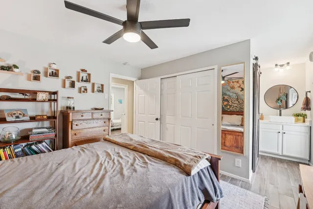 a bedroom with a bed and a cabinets