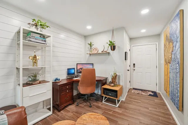 a workspace with furniture and wooden floor