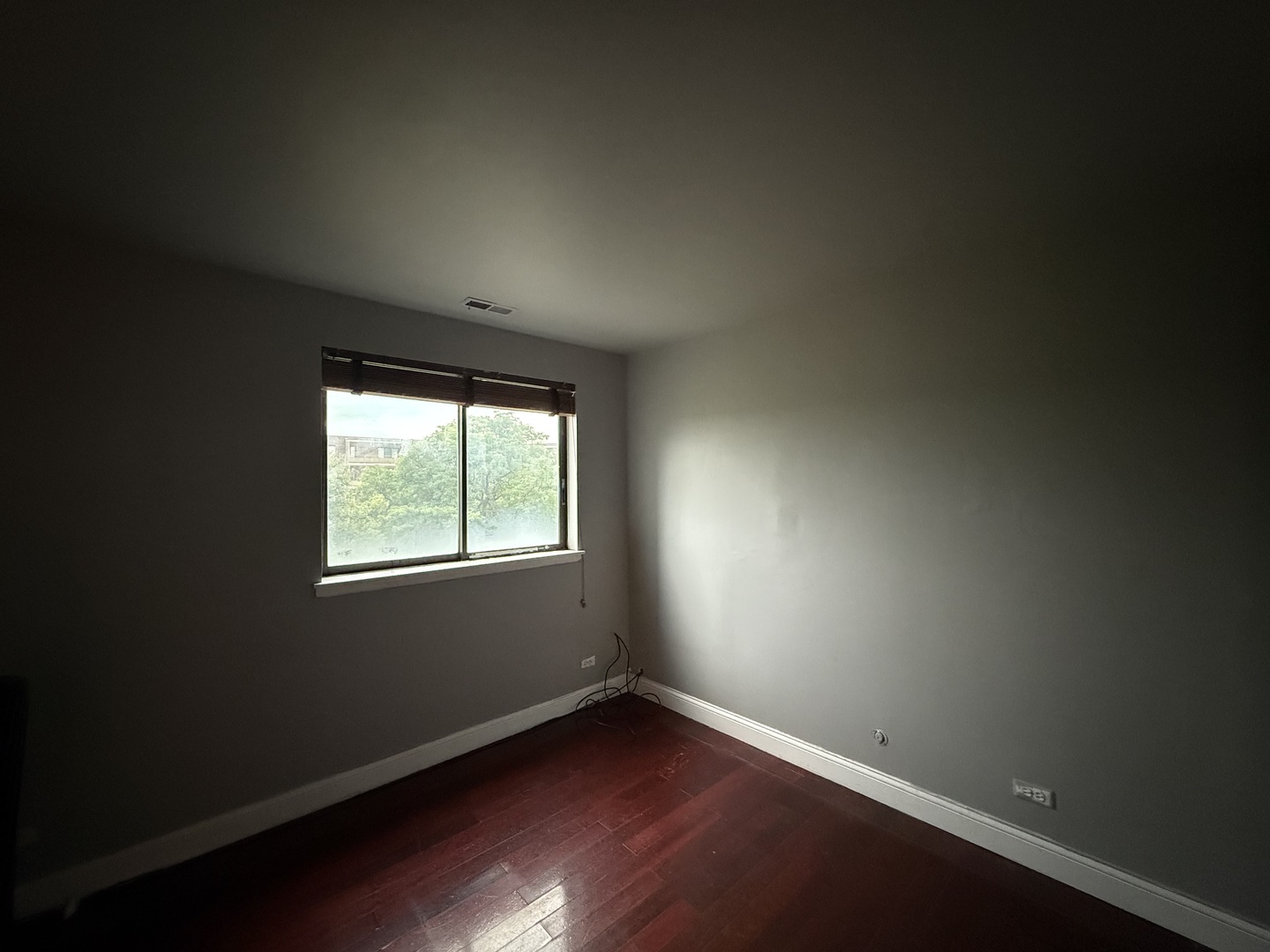 7 East Carriageway Drive, Unit 311 Hazel Crest, IL 60429 - Photo 12 of 17 an empty room with wooden floor and windows