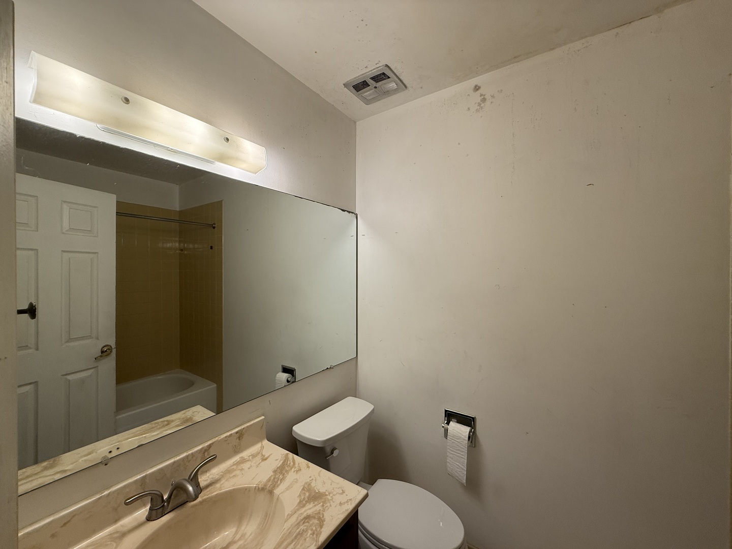 7 East Carriageway Drive, Unit 311 Hazel Crest, IL 60429 - Photo 14 of 17 a bathroom with a granite countertop sink mirror and toilet