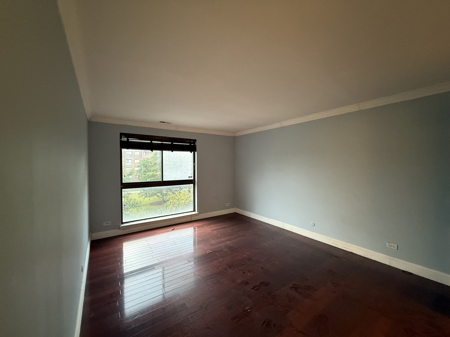 7 East Carriageway Drive, Unit 311 Hazel Crest, IL 60429 - Photo 15 of 17 an empty room with wooden floor and windows
