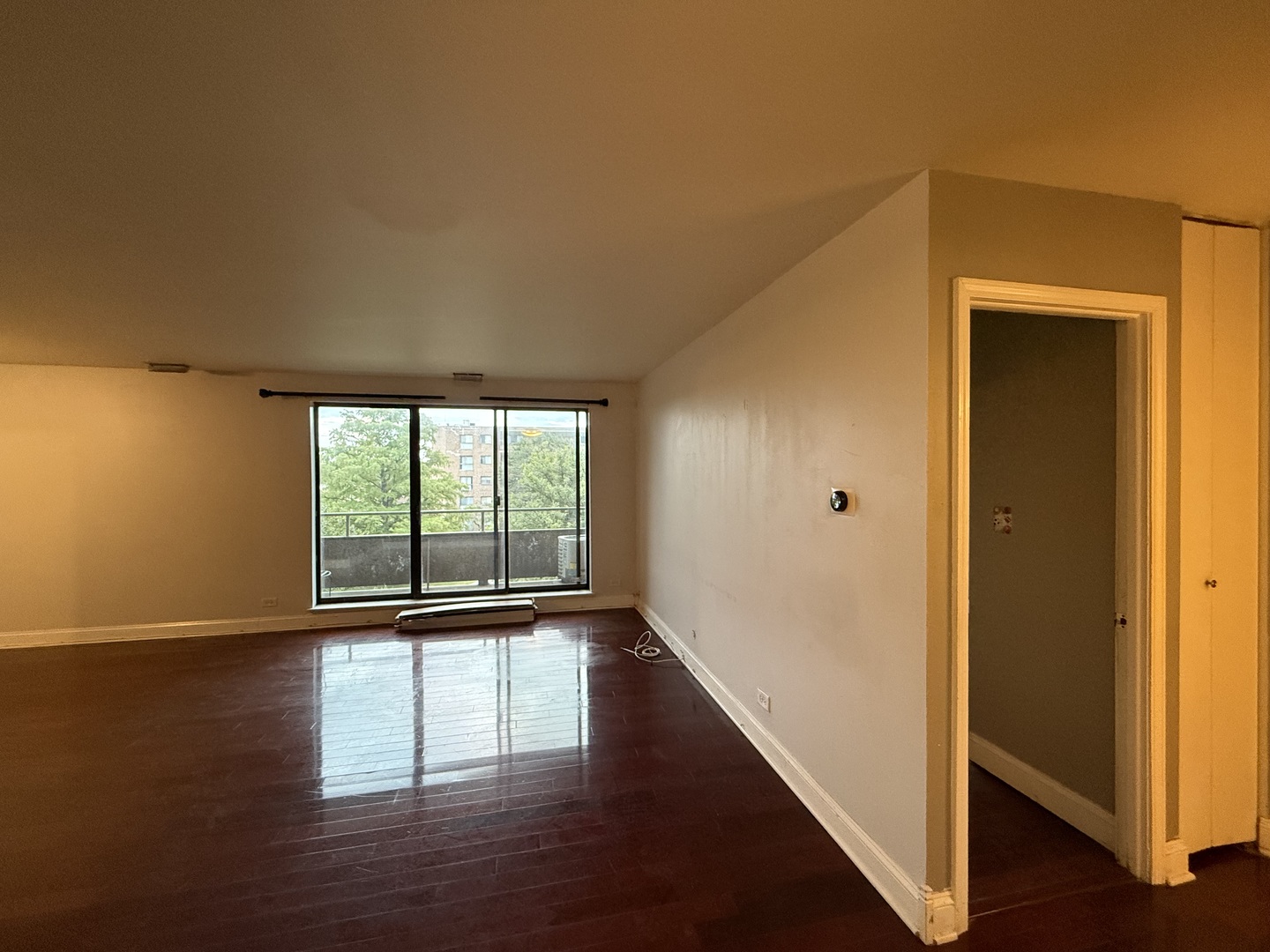 7 East Carriageway Drive, Unit 311 Hazel Crest, IL 60429 - Photo 3 of 17 a view of empty room with wooden floor and fan