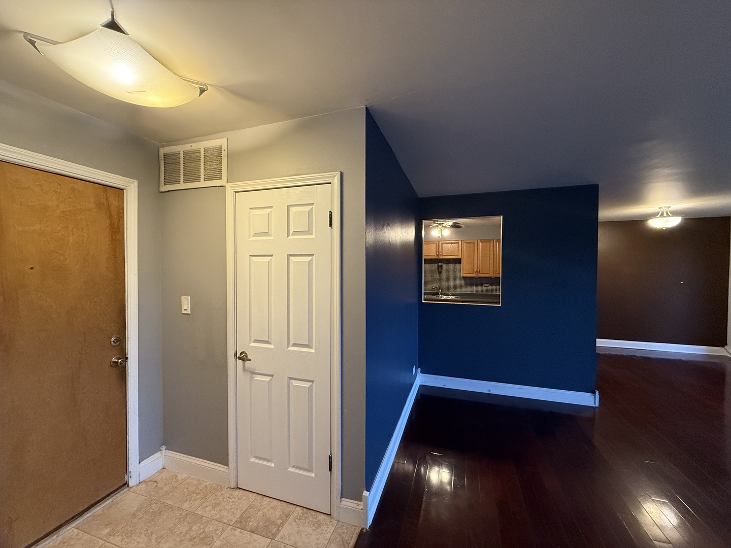 7 East Carriageway Drive, Unit 311 Hazel Crest, IL 60429 - Photo 4 of 17 a view of an empty room with wooden floor and a window