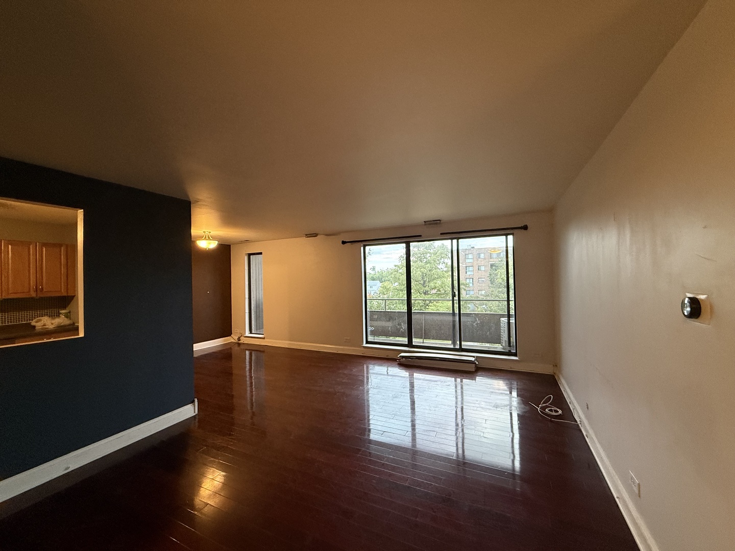 7 East Carriageway Drive, Unit 311 Hazel Crest, IL 60429 - Photo 5 of 17 a view of empty room with wooden floor and fan