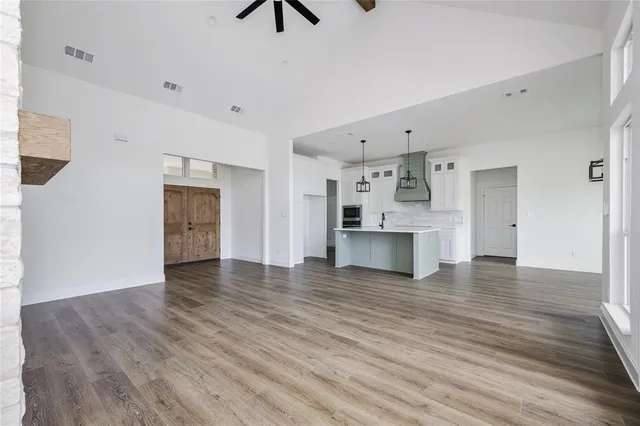 a view of a kitchen with a sink and a kitchen area