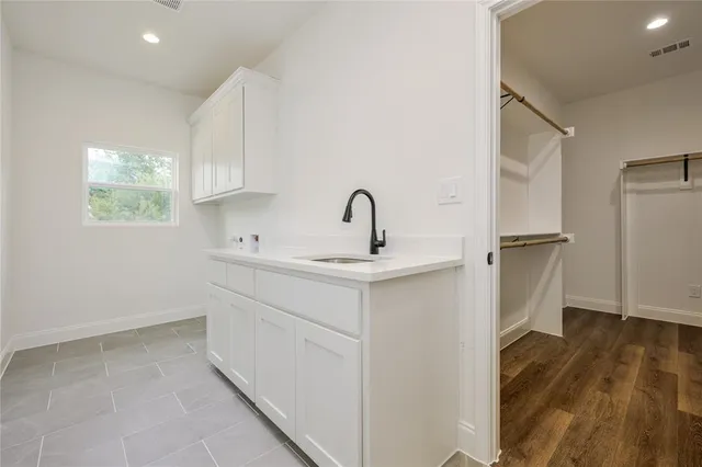 a kitchen with a sink and refrigerator