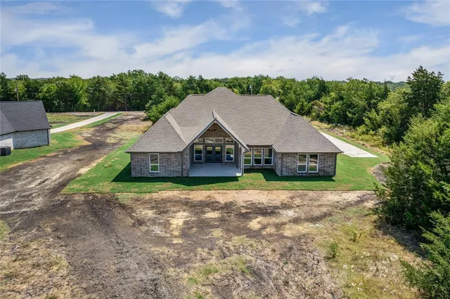 a house with trees in the background