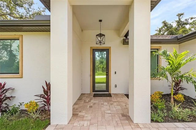 a view of an entryway with wooden floor