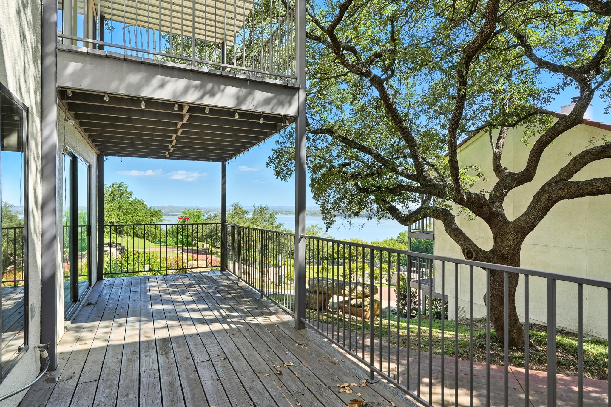 2918 Ranch Road 620 North, Unit C115 Austin, TX 78734 - Photo 19 of 39 Wooden deck with a water view