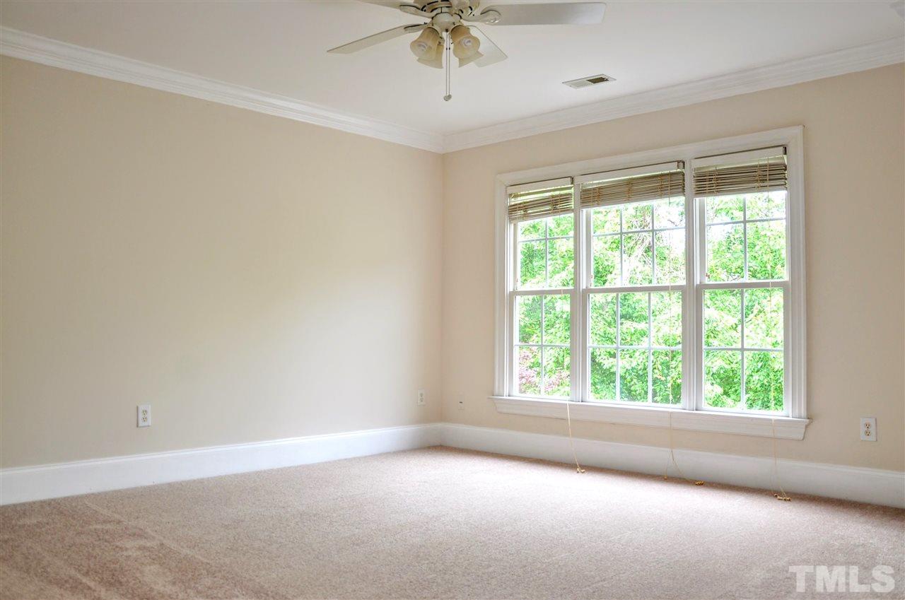 6902 Ray Road Raleigh, NC 27613 - Photo 11 of 23 an empty room with a window and a fan