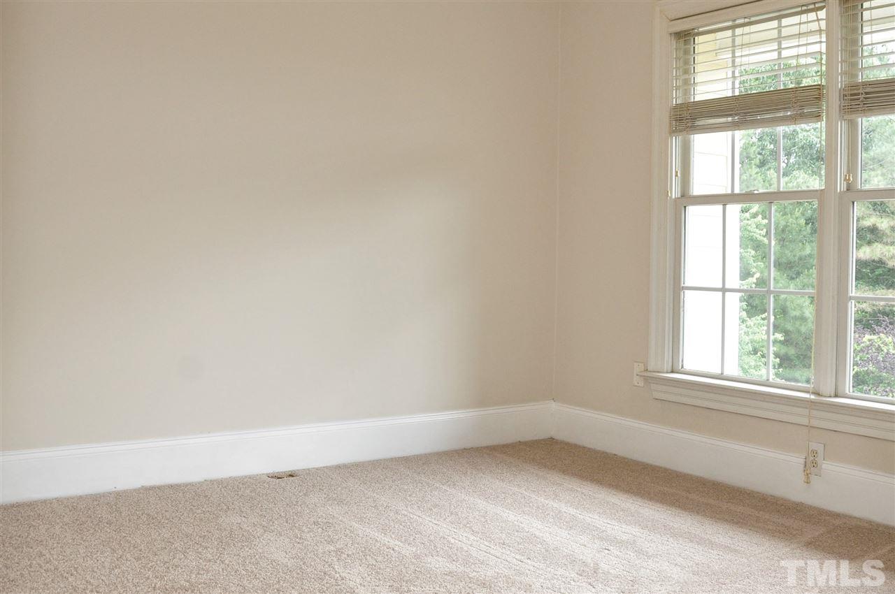6902 Ray Road Raleigh, NC 27613 - Photo 16 of 23 an empty room with a window