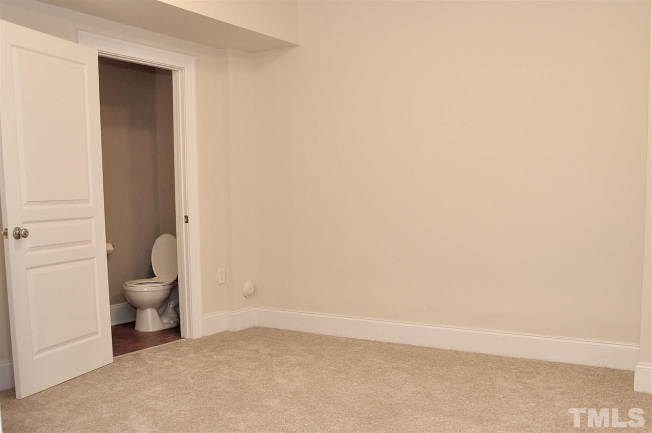 6902 Ray Road Raleigh, NC 27613 - Photo 17 of 23 a bathroom with a toilet