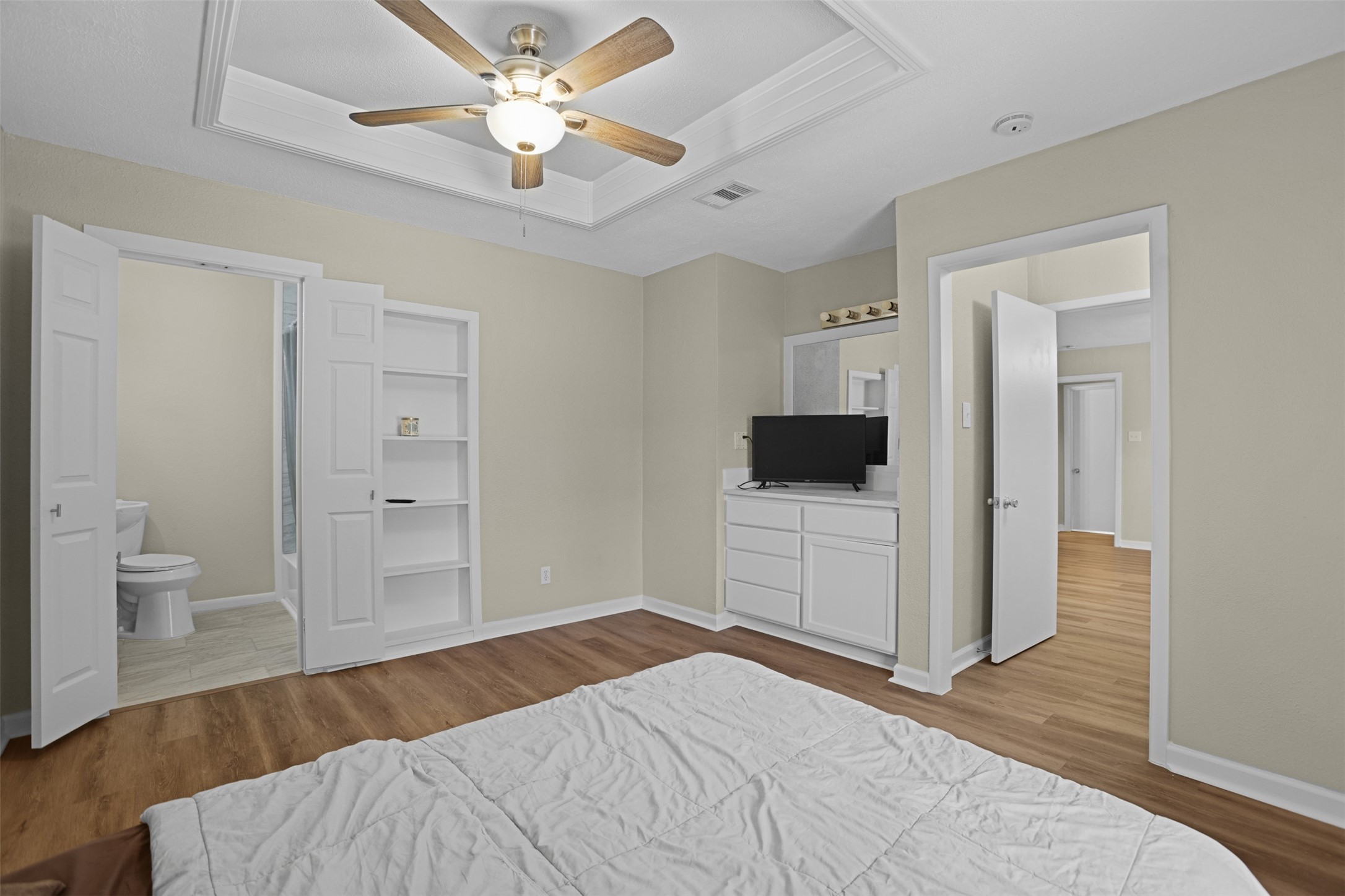 3709 Washington Street Pasadena, TX 77503 - Photo 13 of 22 a bedroom with a bed and a flat screen tv