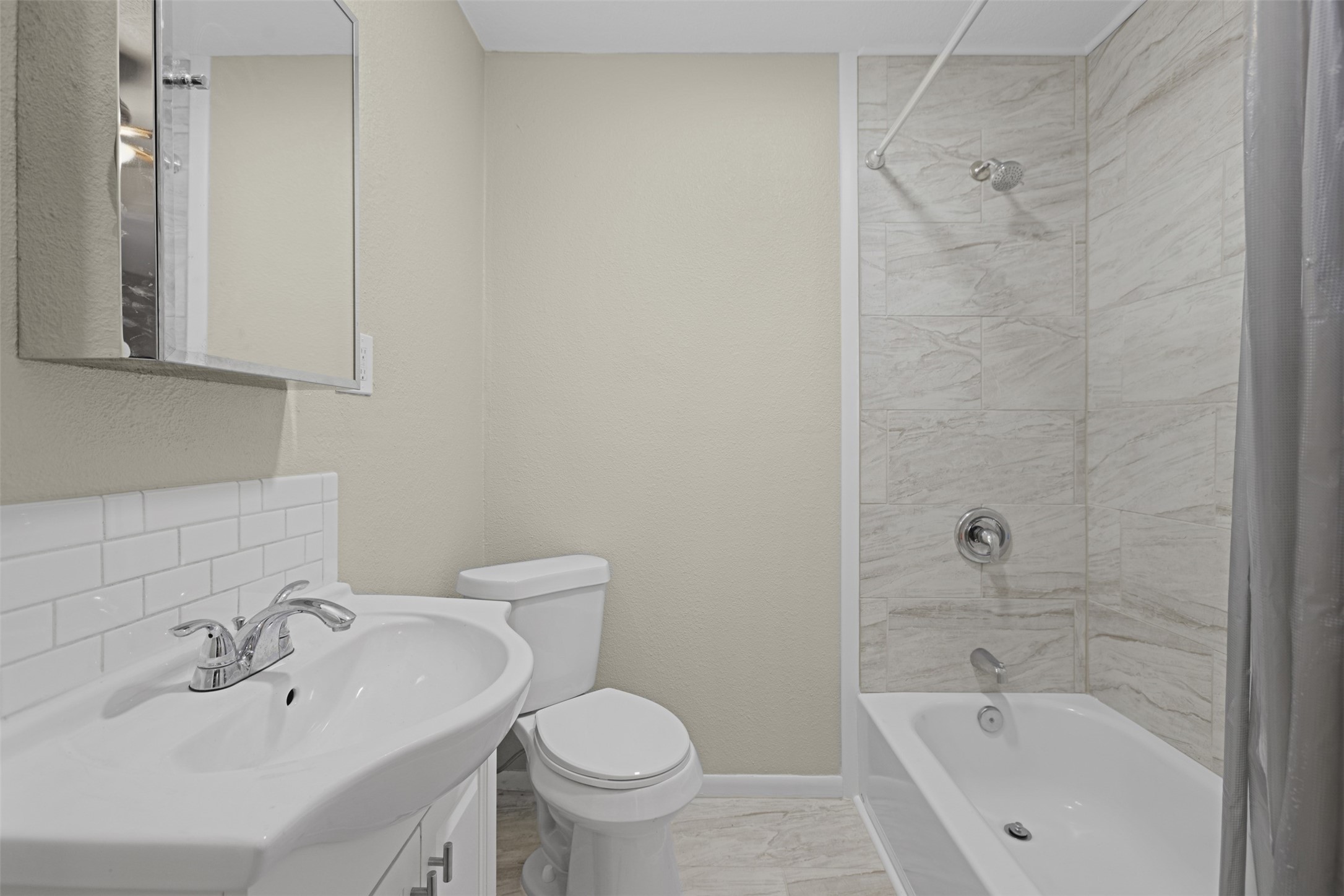 3709 Washington Street Pasadena, TX 77503 - Photo 14 of 22 a bathroom with a bathtub shower sink vanity and toilet