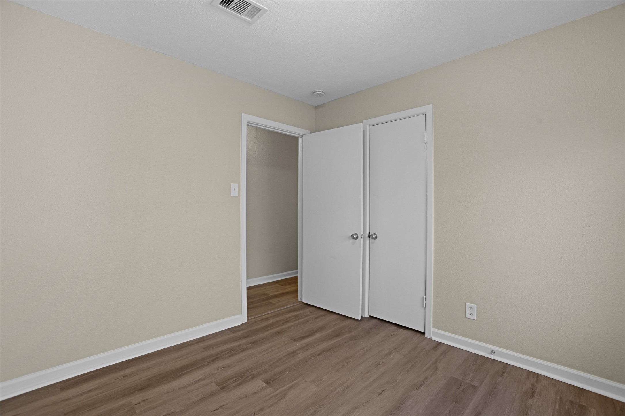 3709 Washington Street Pasadena, TX 77503 - Photo 19 of 22 a view of an empty room with wooden floor