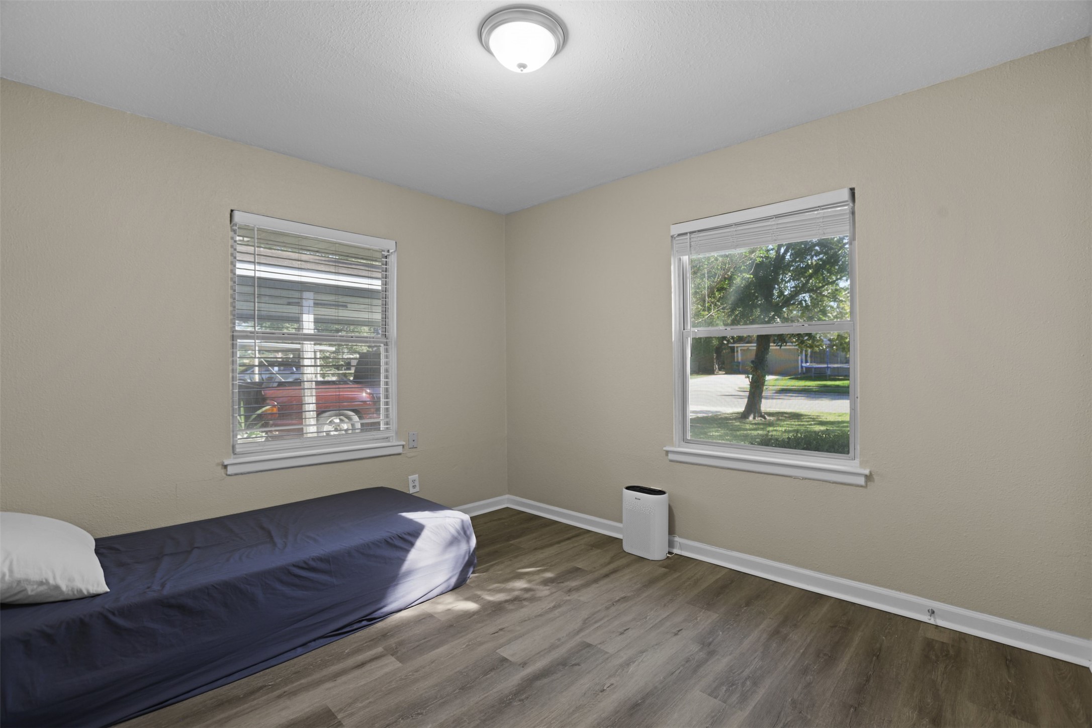 3709 Washington Street Pasadena, TX 77503 - Photo 20 of 22 a view of an empty room with wooden floor and a window