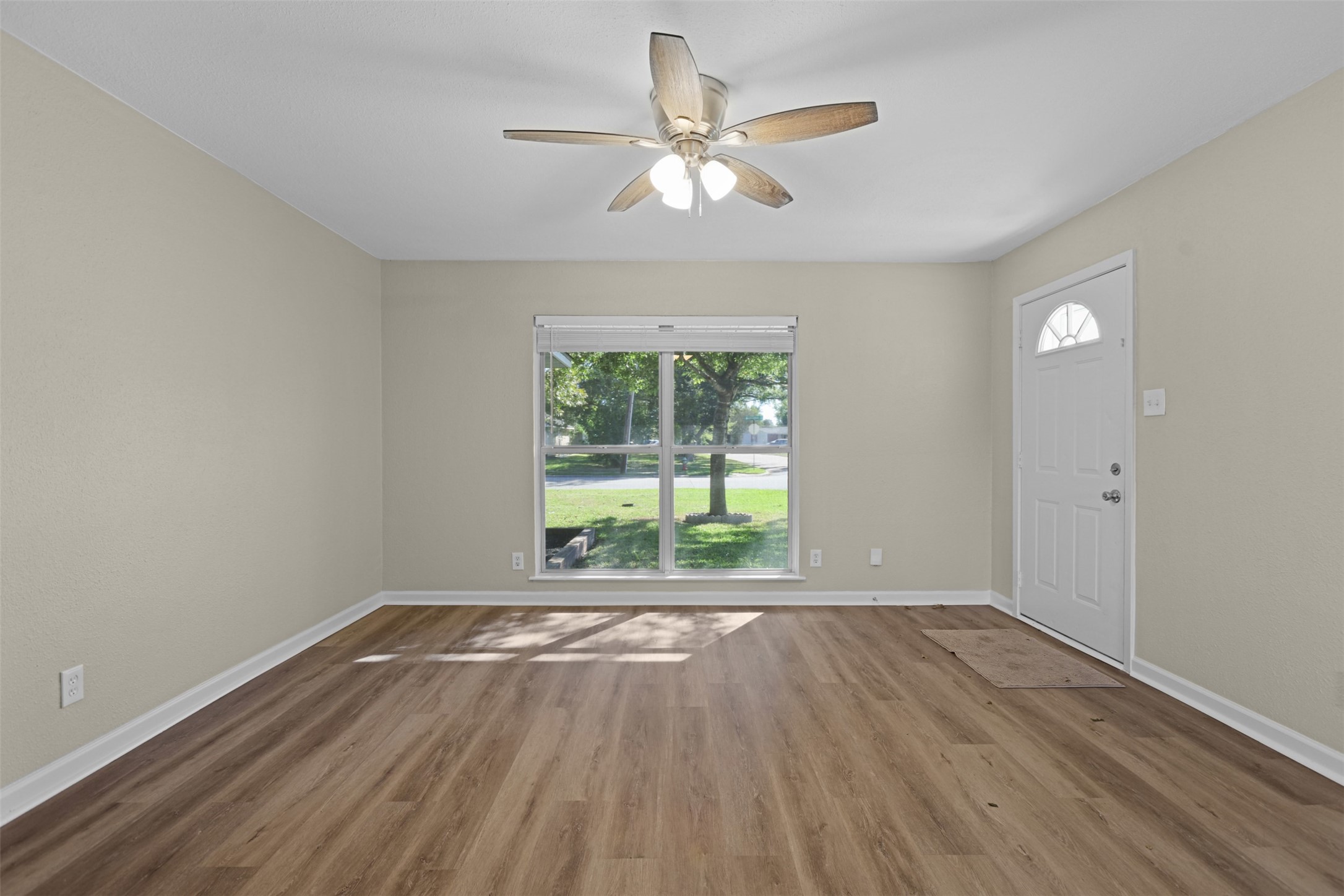 3709 Washington Street Pasadena, TX 77503 - Photo 22 of 22 a view of an empty room with wooden floor and a window