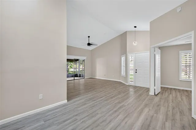 wooden floor in an empty room with a window