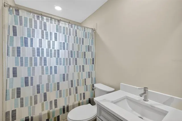 a bathroom with a sink and toilet