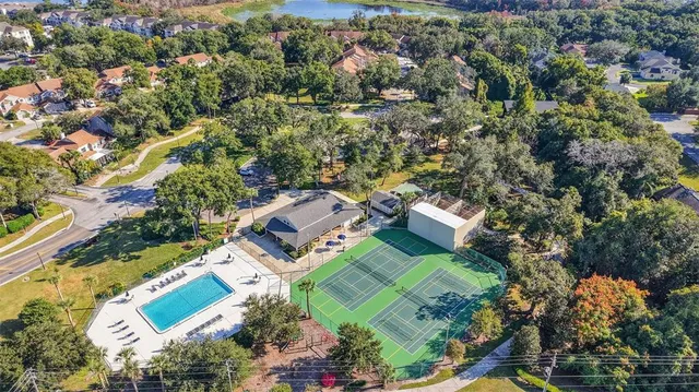 an aerial view of a house with a yard