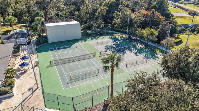 an aerial view of a house with a garden and swimming pool