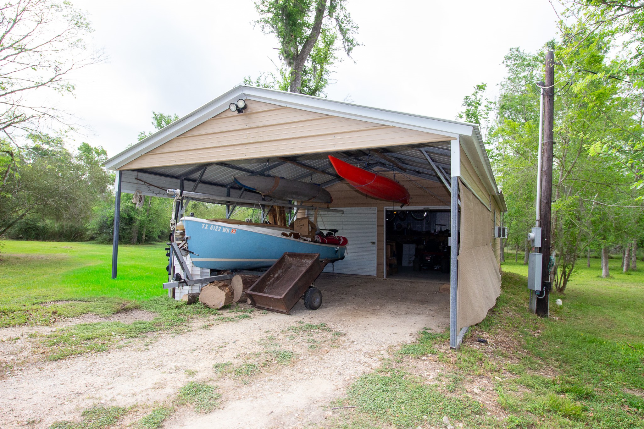 40411 Bosque Road Hempstead, TX 77445 - Photo 21 of 25 Insulated garage equipped with four dedicated circuits, ideal for a workshop setup and handling multiple tools with ease.