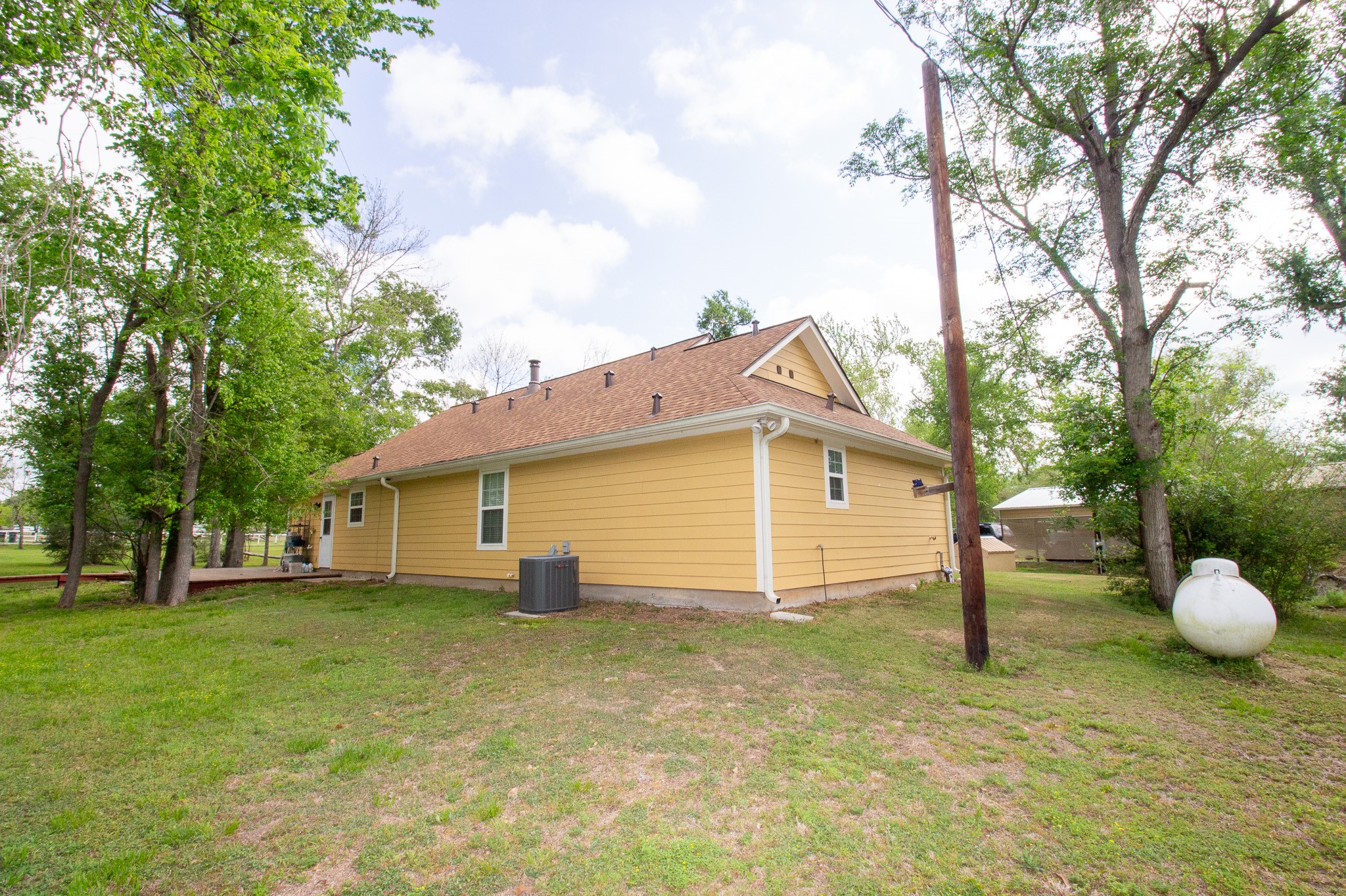 40411 Bosque Road Hempstead, TX 77445 - Photo 7 of 25 Emergency generator inlet at the power pole allows for easy backup power connection, complemented by proper panel safeguards and a surge protector for added comfort, safety, and peace of mind.