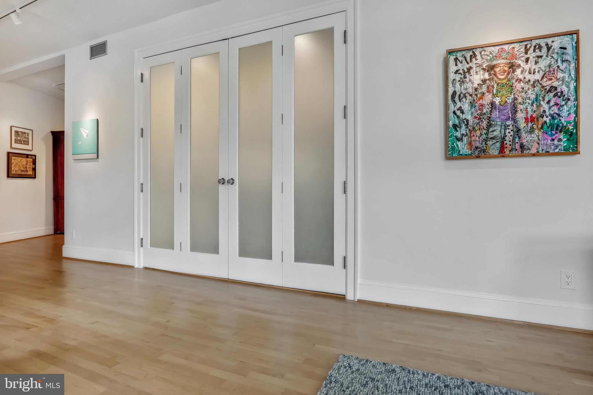 2022 Columbia Road Northwest, Unit 112 Washington, DC 20009 - Photo 20 of 41 Custom double bi-fold doors conceal kitchen