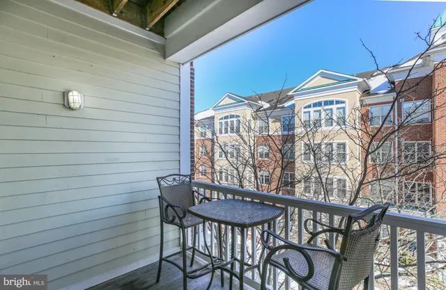 a view of a patio with a table and chairs
