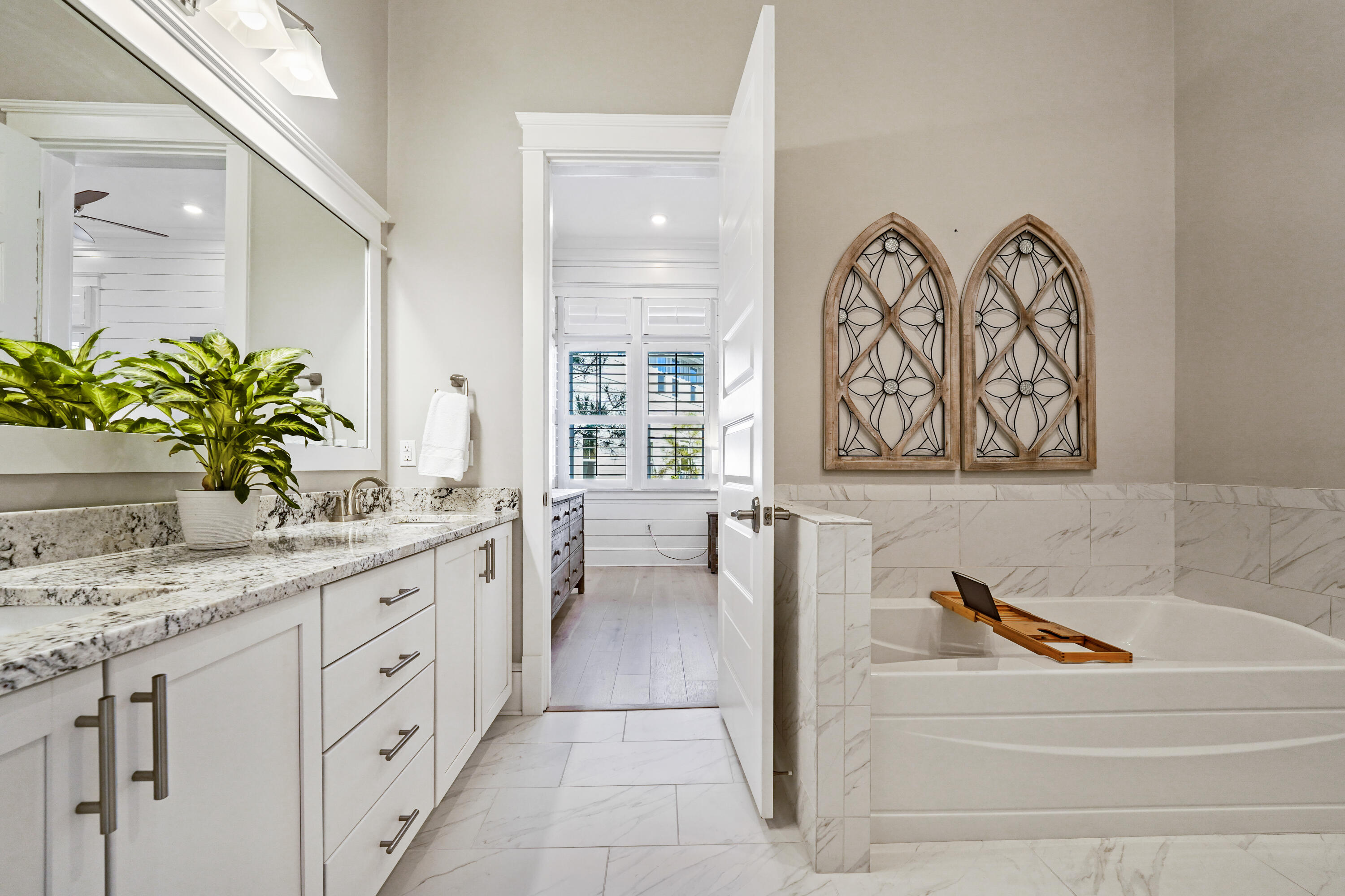 82 Siasconset Ln Inlet Beach Inlet Beach, FL 32461 - Photo 18 of 42 a spacious bathroom with a granite countertop tub a mirror and shower