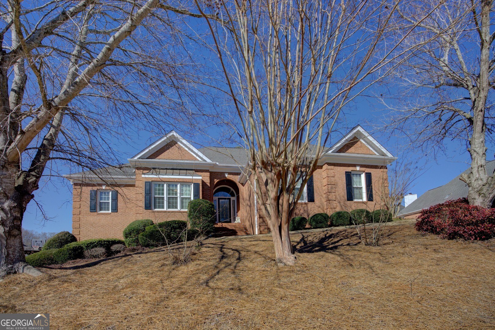 a front view of a house with a yard
