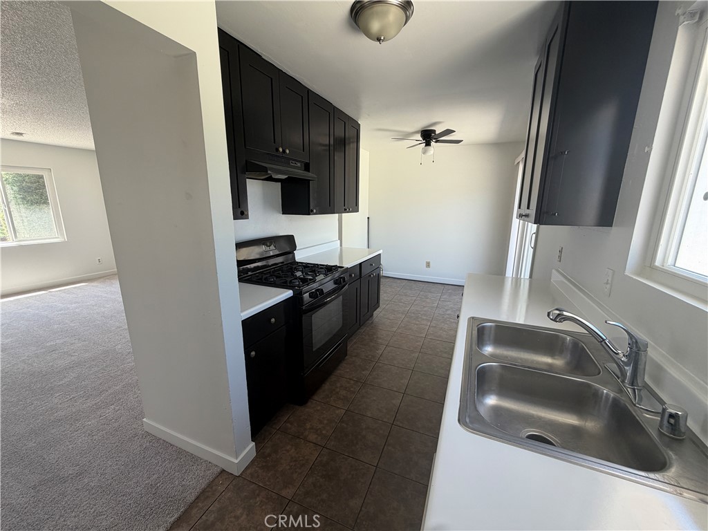 14538 Springvale Street Poway, CA 92064 - Photo 16 of 47 a kitchen that has a sink and a stove