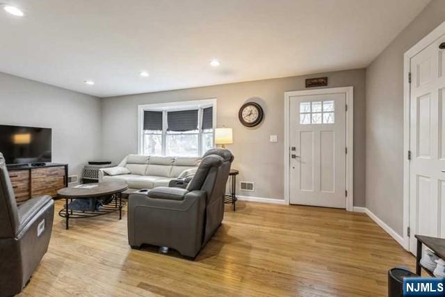 23 Asmus Road Closter, NJ 07624 - Photo 3 of 38 a living room with furniture and a flat screen tv