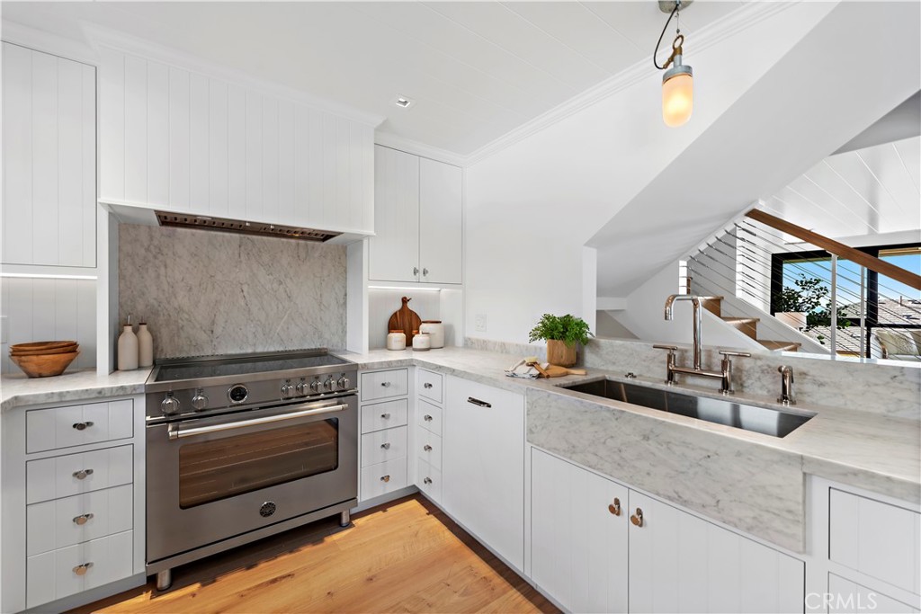 25 Blue Lagoon Laguna Beach, CA 92651 - Photo 11 of 53 a kitchen with cabinets appliances and a counter top