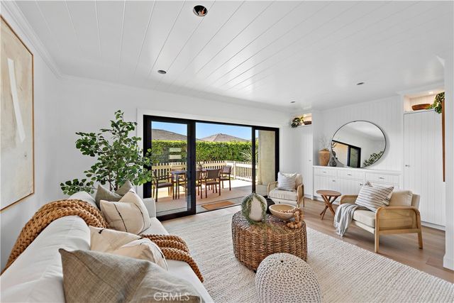 a living room with furniture or couch and a wooden floor