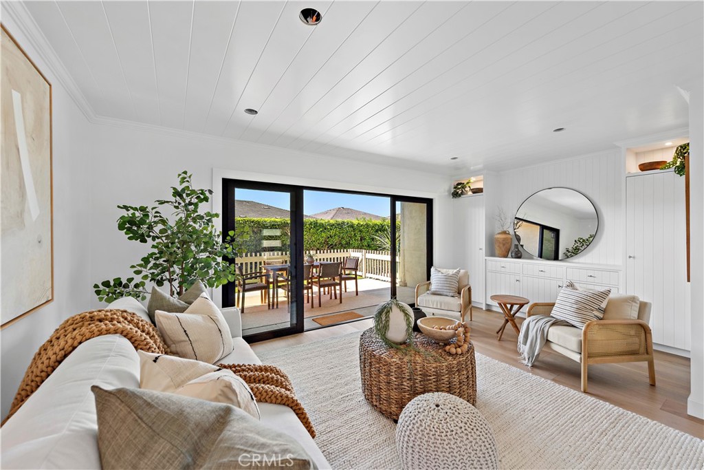 25 Blue Lagoon Laguna Beach, CA 92651 - Photo 18 of 53 a living room with furniture and a large window