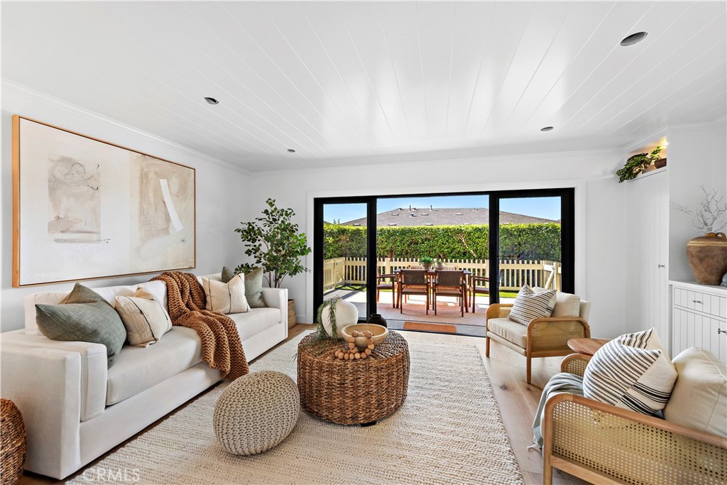 25 Blue Lagoon Laguna Beach, CA 92651 - Photo 19 of 53 a living room with furniture and a large window