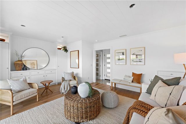 a view of a patio with dining table and chairs with wooden floor and fence