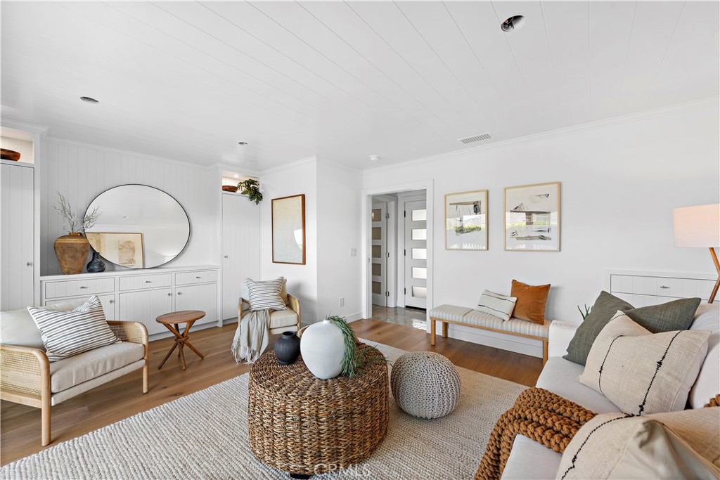 25 Blue Lagoon Laguna Beach, CA 92651 - Photo 20 of 53 a living room with furniture or couch and a wooden floor