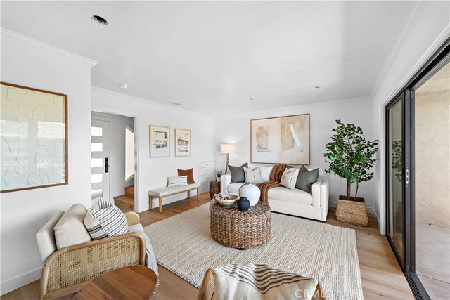 a view of a chairs and table in the balcony