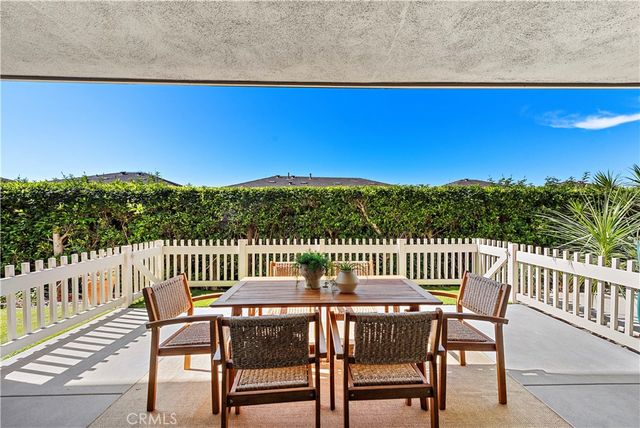 a bedroom with bed and a chandelier