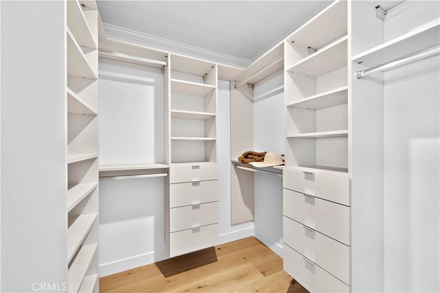 a bathroom with a sink a mirror and a shower
