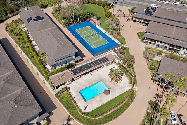 an aerial view of a house with a swimming pool