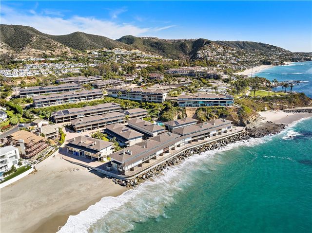 an aerial view of a house with a ocean view